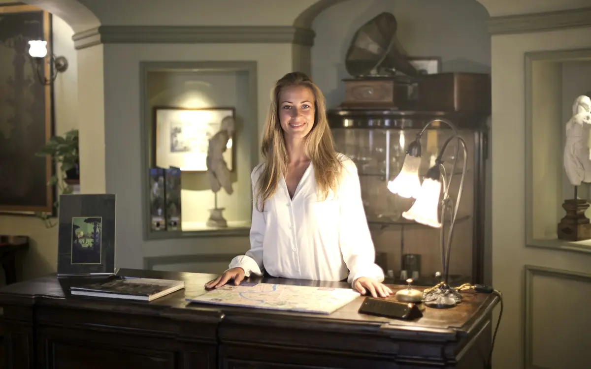Welcoming guests at a hotel reception desk